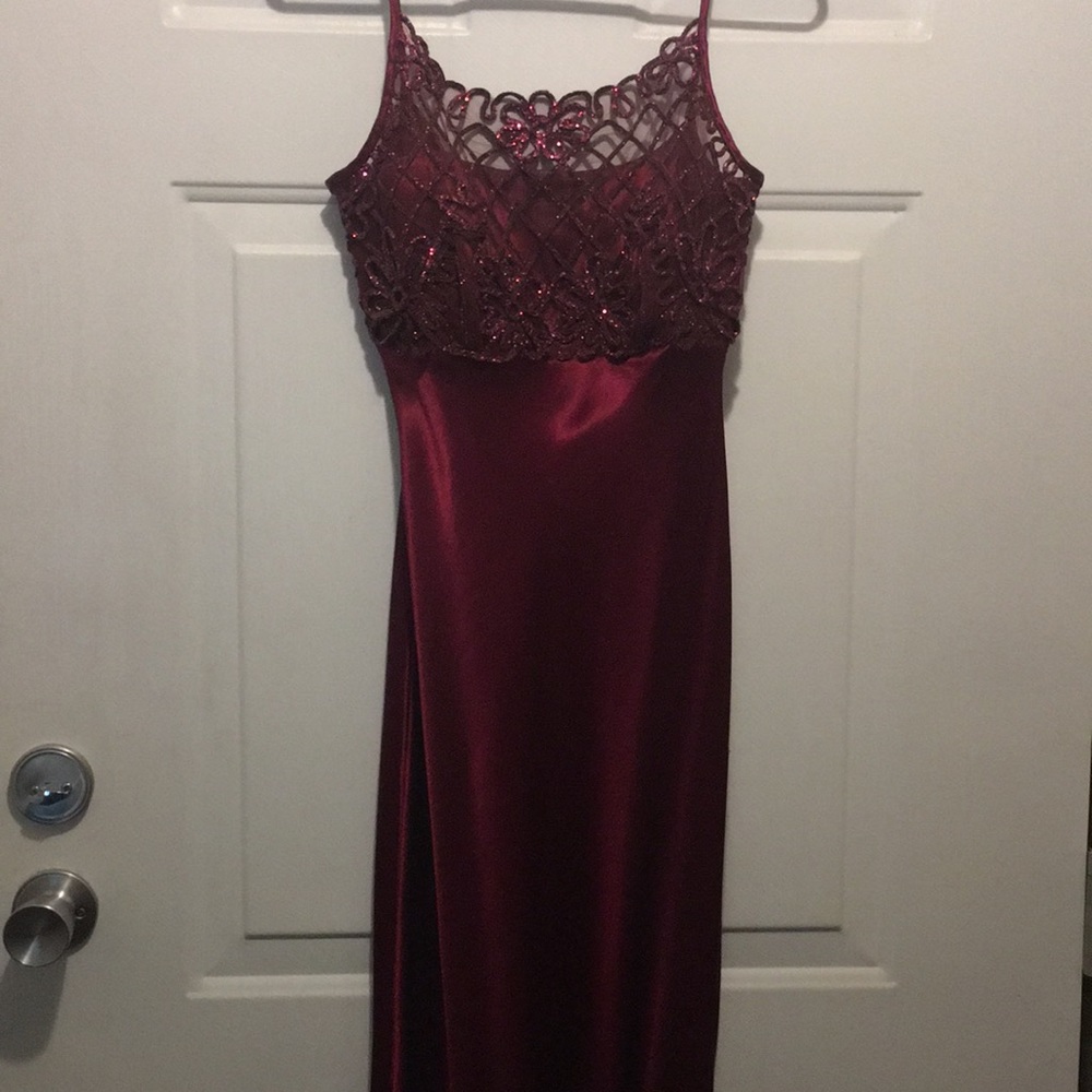 Satin floor length burgundy dress.